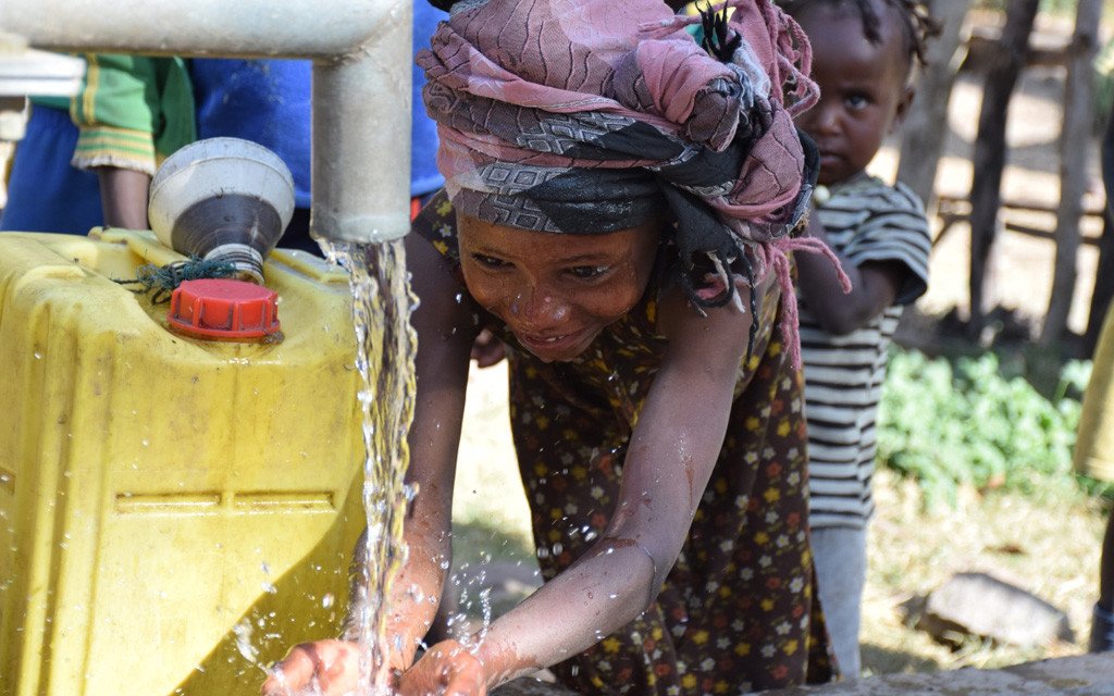 This little girls lives in Mesreta, Southern Ethiopia. Before aborehol was constructed by EKHC, people had to travel to the river to collect water which was often dirty. With aborehole right in the village, the community how has access to fresh clean water.
